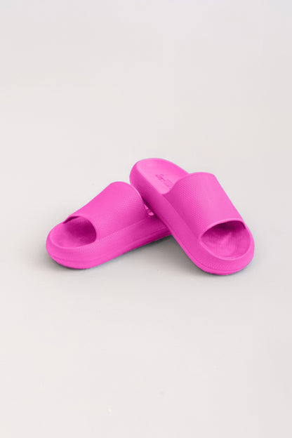 Pair of pink slides on a light gray background