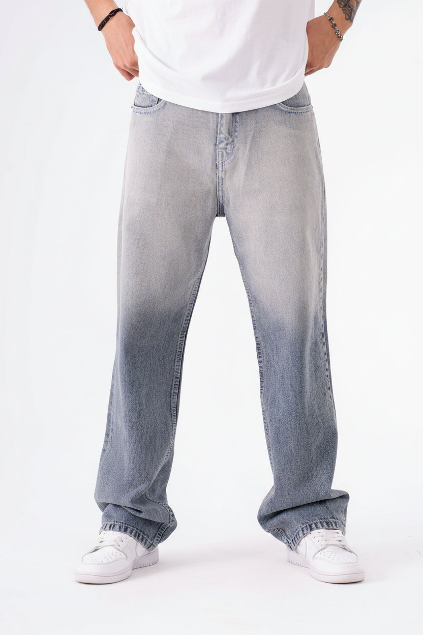 Person wearing light blue in dark blue jeans on a white background