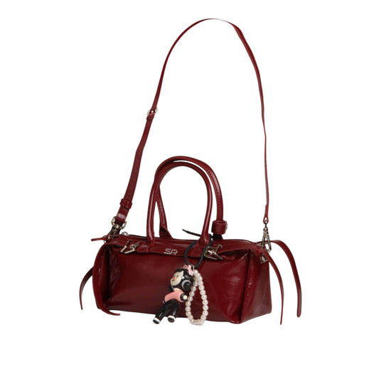 Elegant Leather Handbag with Medal