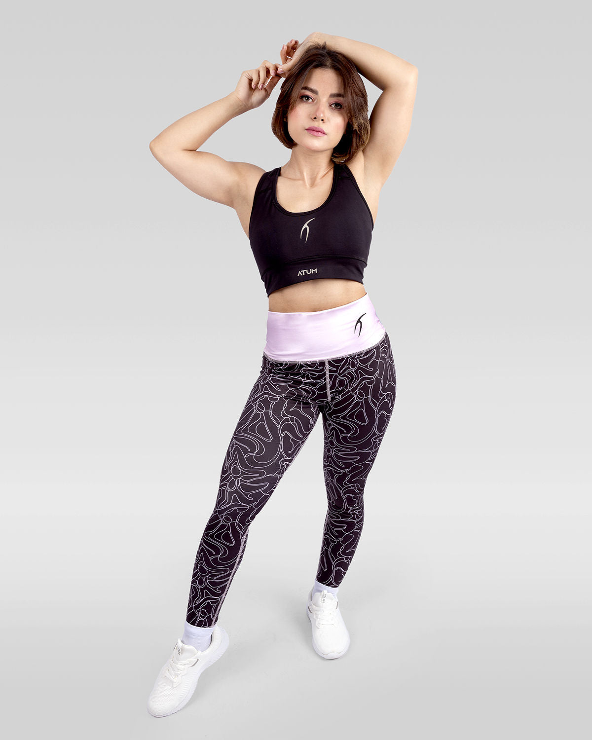 Photo by ð—”ð—§ð—¨ð— SPORTSWEAR Â® on December 20, 2022. May be an image of 1 woman wears rose printed leggings, black sports bra ,and white shoes.