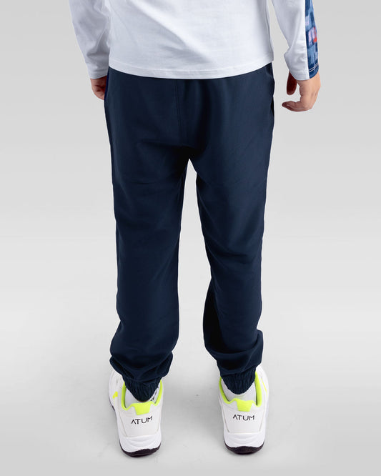 بنطال تدريب أساسي باللون الأزرق البحري للأولاد المراهقين